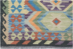 Handwoven Afghan Maimana kilim rug featuring a colorful geometric pattern on a wool flatweave.