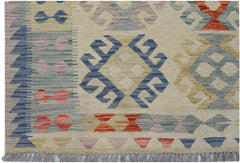 Handwoven Afghan Maimana kilim featuring geometric patterns in blue, red, and neutral tones.