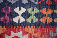 Handwoven Afghan Maimana kilim featuring a geometric pattern in vibrant wool colors.