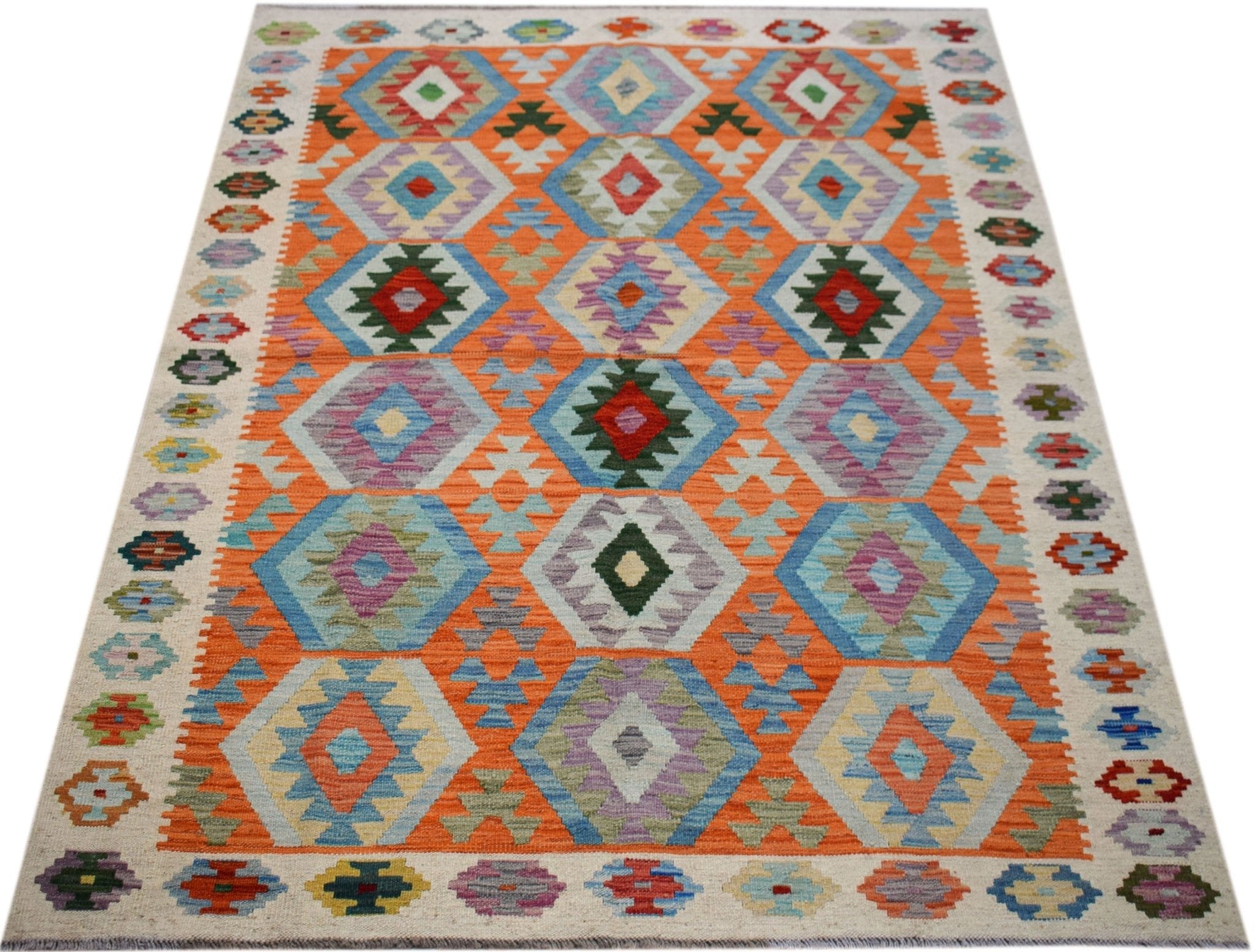 Handmade Afghan Maimana kilim rug featuring a vibrant orange background with geometric patterns.