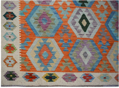 Handwoven Afghan Maimana kilim featuring a vibrant geometric pattern in wool.
