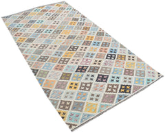 Handmade Afghan Maimana kilim rug featuring a colorful geometric diamond pattern in wool.