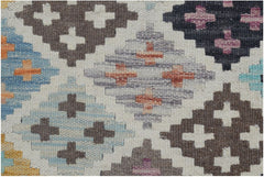Handmade Afghan Maimana kilim rug featuring a geometric diamond pattern in multicolored wool.