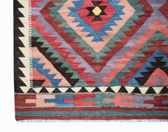 Handwoven Afghan Maimana kilim featuring a geometric diamond pattern in vibrant wool colors.