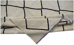 Handwoven Afghan Maimana kilim featuring a cream wool base with a black geometric grid pattern.