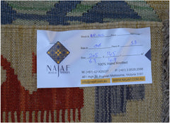 A handwoven Afghan Maimana Kilim rug featuring a flatweave texture and geometric patterns.