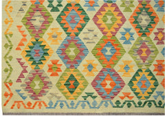 Handwoven Afghan Maimana kilim rug featuring a colorful geometric diamond pattern on a cream base.