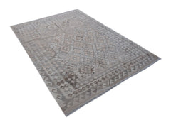 A rectangular Afghan Maiamana kilim rug featuring a neutral geometric pattern in natural wool.