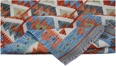 Handwoven Afghan Maimana kilim rug featuring a geometric pattern in blue, orange, and green wool.
