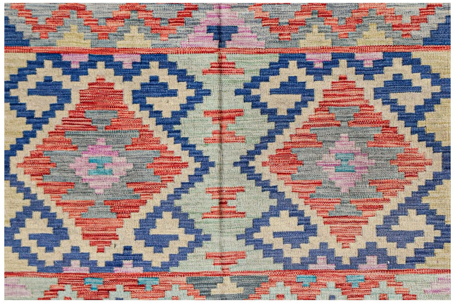 Handwoven Afghan Maimana kilim featuring a geometric diamond pattern in blue, red, and beige.