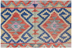 Handwoven Afghan Maimana kilim featuring a geometric diamond pattern in blue, red, and beige.