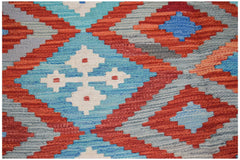 Afghan Maimana Kilim with geometric patterns in red, blue, and white.