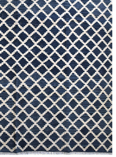 Handmade Afghan Maimana kilim rug featuring a dark blue and cream geometric lattice pattern.