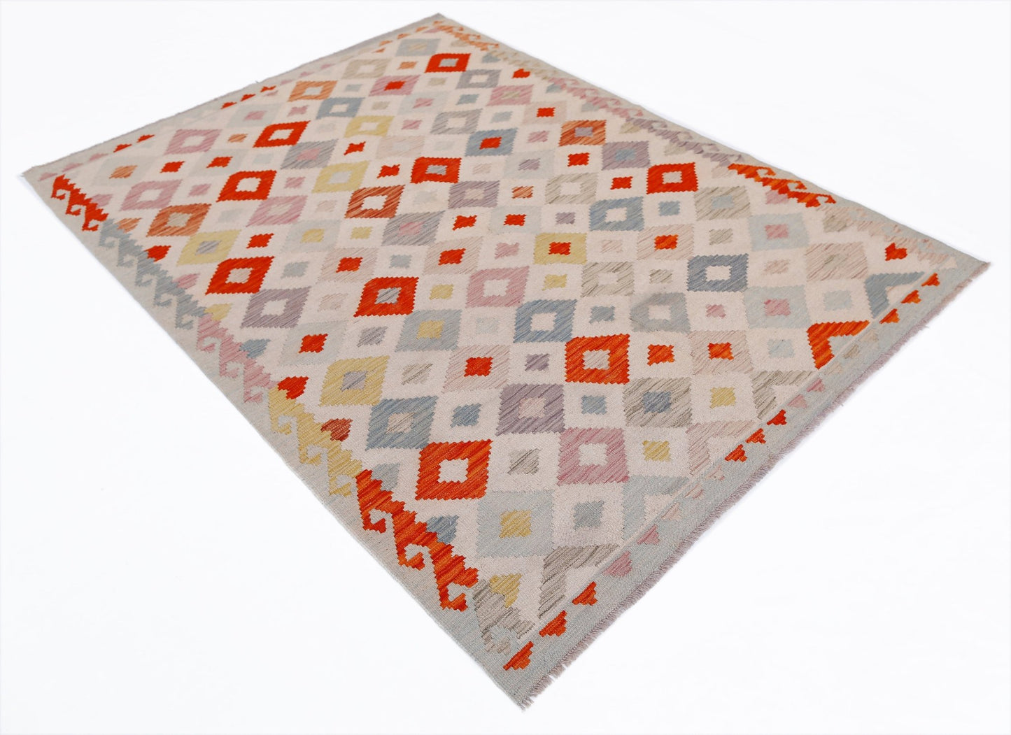 Handwoven Afghan Maimana kilim rug featuring a geometric diamond pattern in orange and neutral tones.