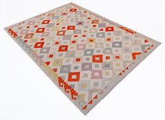 Handwoven Afghan Maimana kilim rug featuring a geometric diamond pattern in orange and neutral tones.