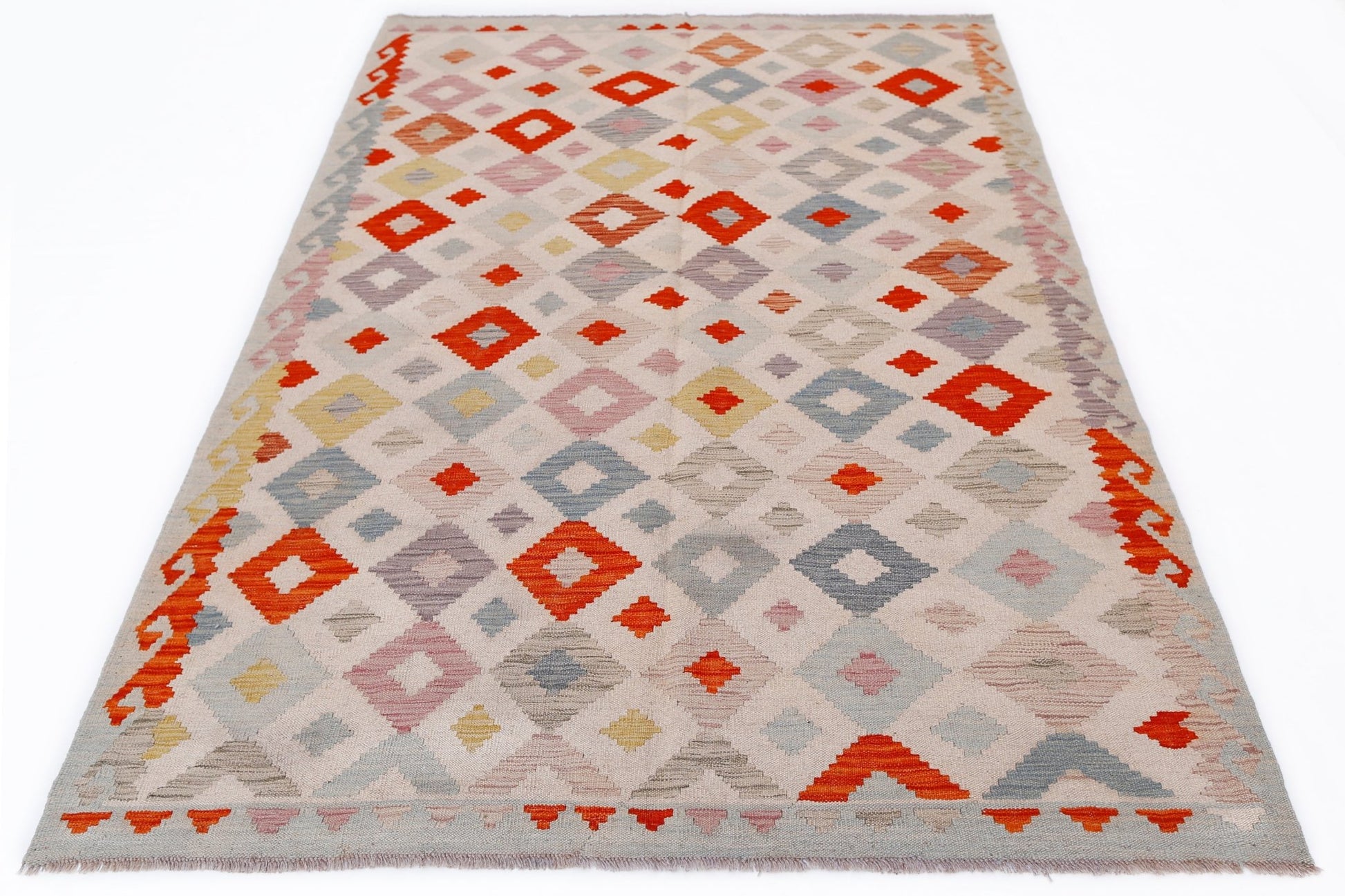 Handwoven Afghan Maimana kilim rug featuring a geometric diamond pattern in vibrant colors.