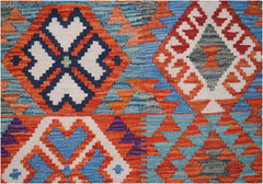 Handwoven Afghan Maimana kilim rug featuring a vibrant geometric pattern in wool.
