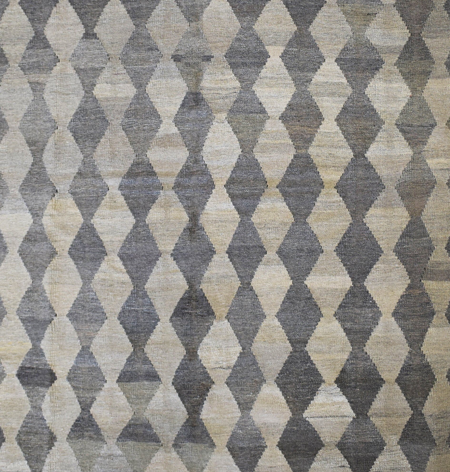 Handmade Afghan Maimana kilim rug featuring a repeating grey and beige diamond pattern.