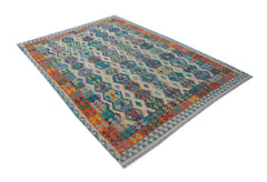 Handwoven Afghan Maimana kilim rug featuring a colorful geometric pattern on a cream background.