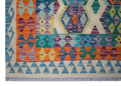 Handwoven Afghan Maimana kilim featuring a vibrant geometric pattern in wool.