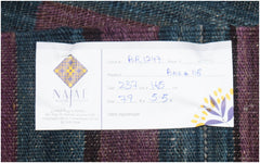 A handmade Afghan Maimana kilim featuring a flatweave texture with dark blue and purple stripes.