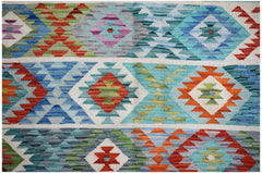 Handwoven Afghan Maimana kilim rug featuring a vibrant geometric pattern in wool.