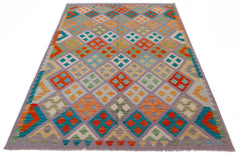 Handwoven Afghan Maimana kilim featuring a colorful geometric diamond pattern on a grey background.