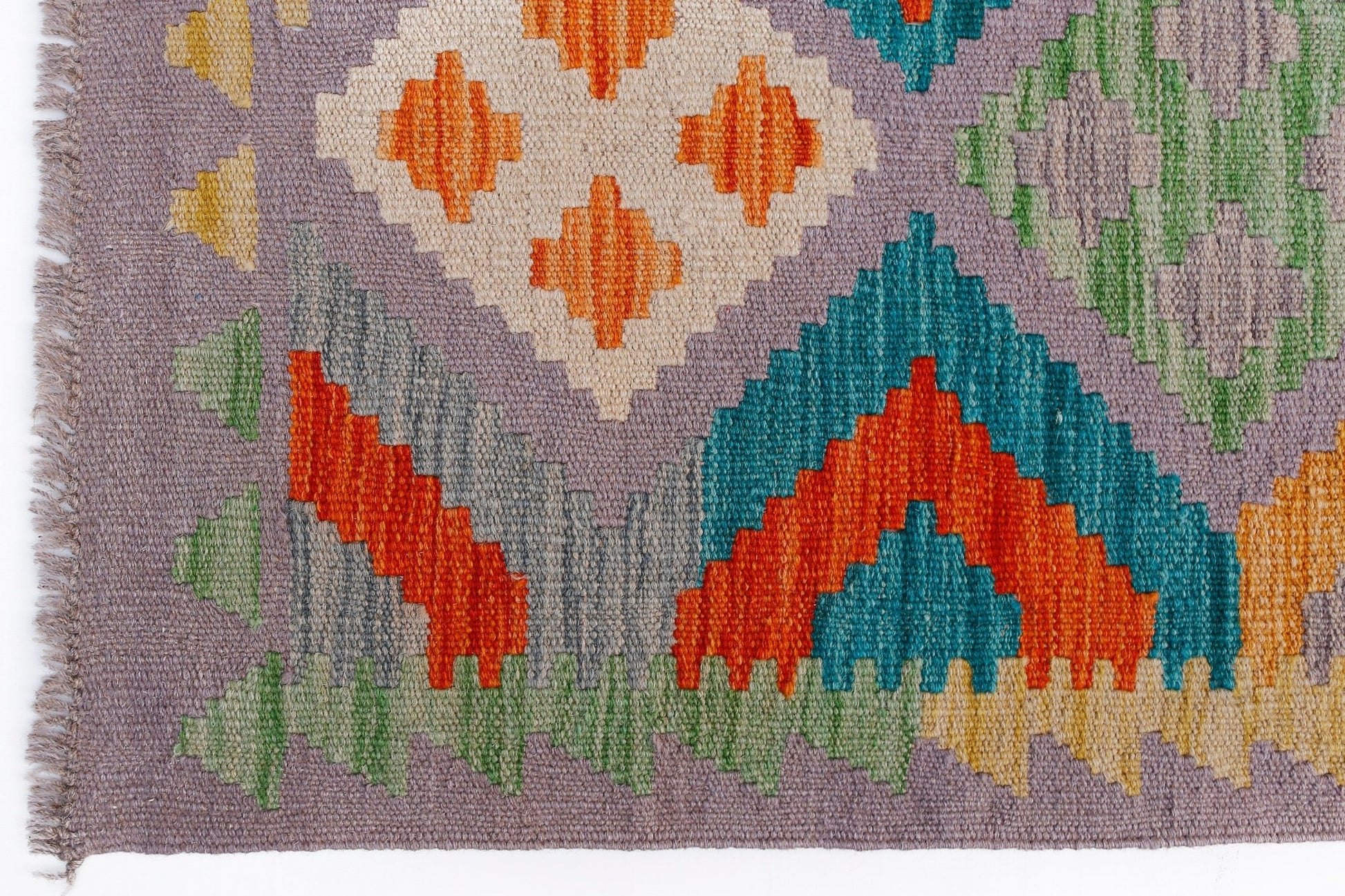 Handwoven Afghan Maimana kilim rug featuring a geometric pattern in vibrant multicolored wool.