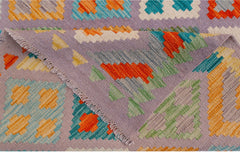 A handwoven Afghan Maimana kilim featuring a geometric pattern in vibrant orange, blue, and green.
