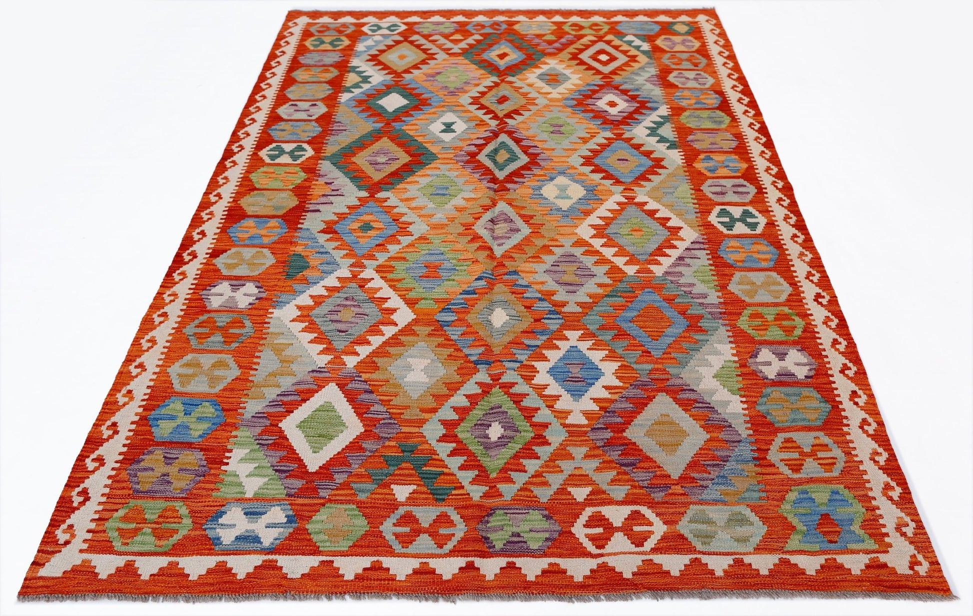 Handwoven Afghan Maimana kilim rug featuring a vibrant geometric diamond pattern in wool.