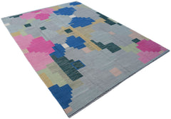 Handwoven Afghan Maimana kilim rug featuring a geometric pattern in blue, pink, and grey tones.