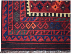 Handwoven Afghan Maimana kilim featuring geometric patterns in red, blue, and orange wool.