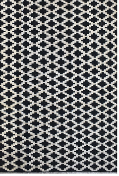 Handmade Afghan Maimana kilim rug featuring a repeating black and white geometric pattern.