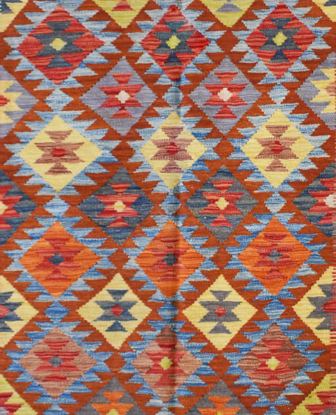 Handmade Afghan Maimana kilim rug featuring a vibrant geometric diamond pattern in wool.