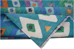 A handmade Afghan Maimana kilim rug featuring a vibrant geometric pattern in wool.