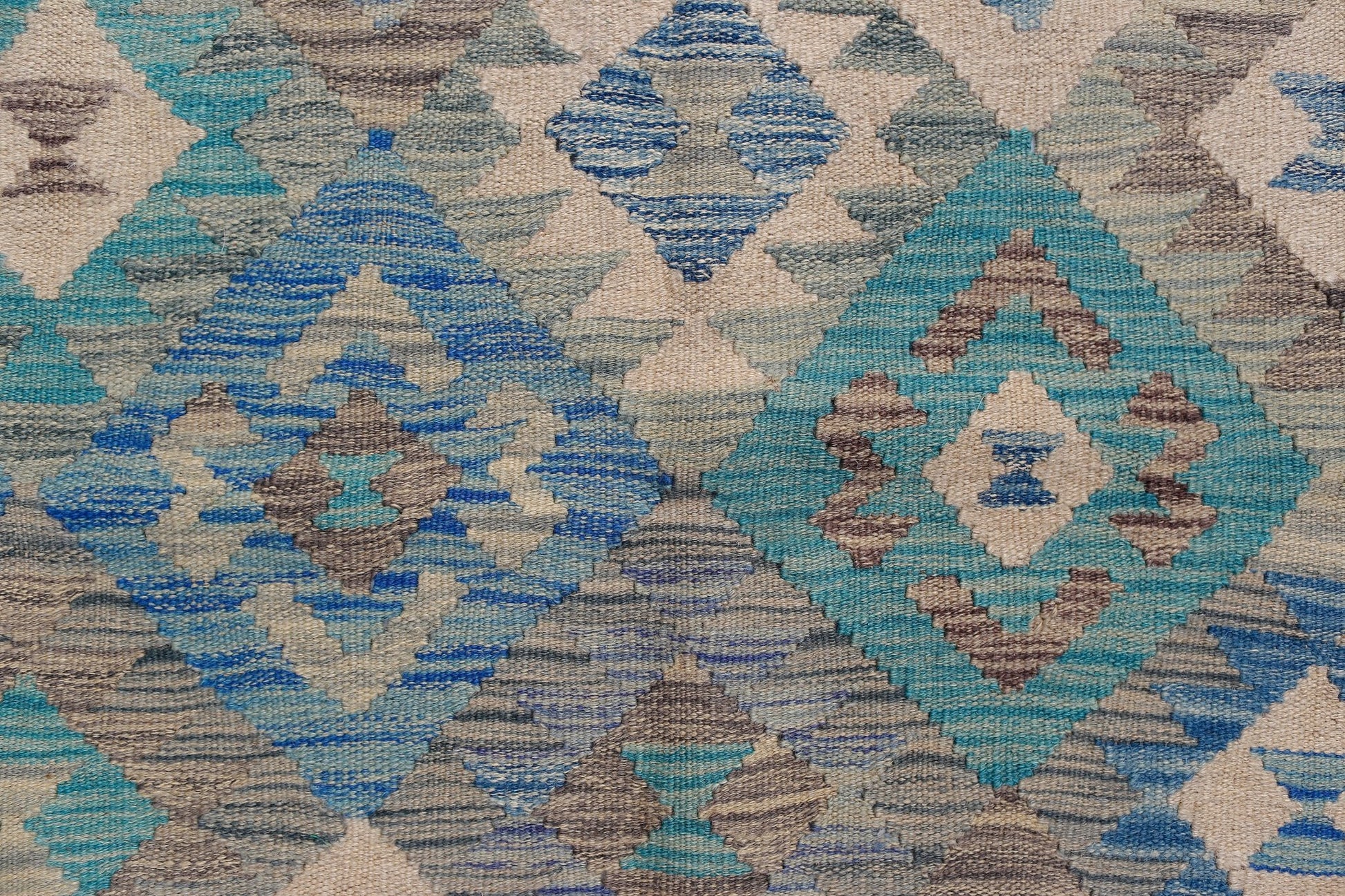 Handwoven Afghan Maimana kilim featuring a geometric diamond pattern in blue, grey, and cream.