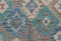 Handwoven Afghan Maimana kilim featuring a geometric diamond pattern in blue, grey, and cream.