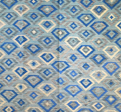Handmade Afghan Maimana kilim rug featuring a repeating geometric diamond pattern in shades of blue.