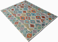 Handwoven Afghan Maimana kilim rug featuring a colorful geometric diamond pattern in wool.