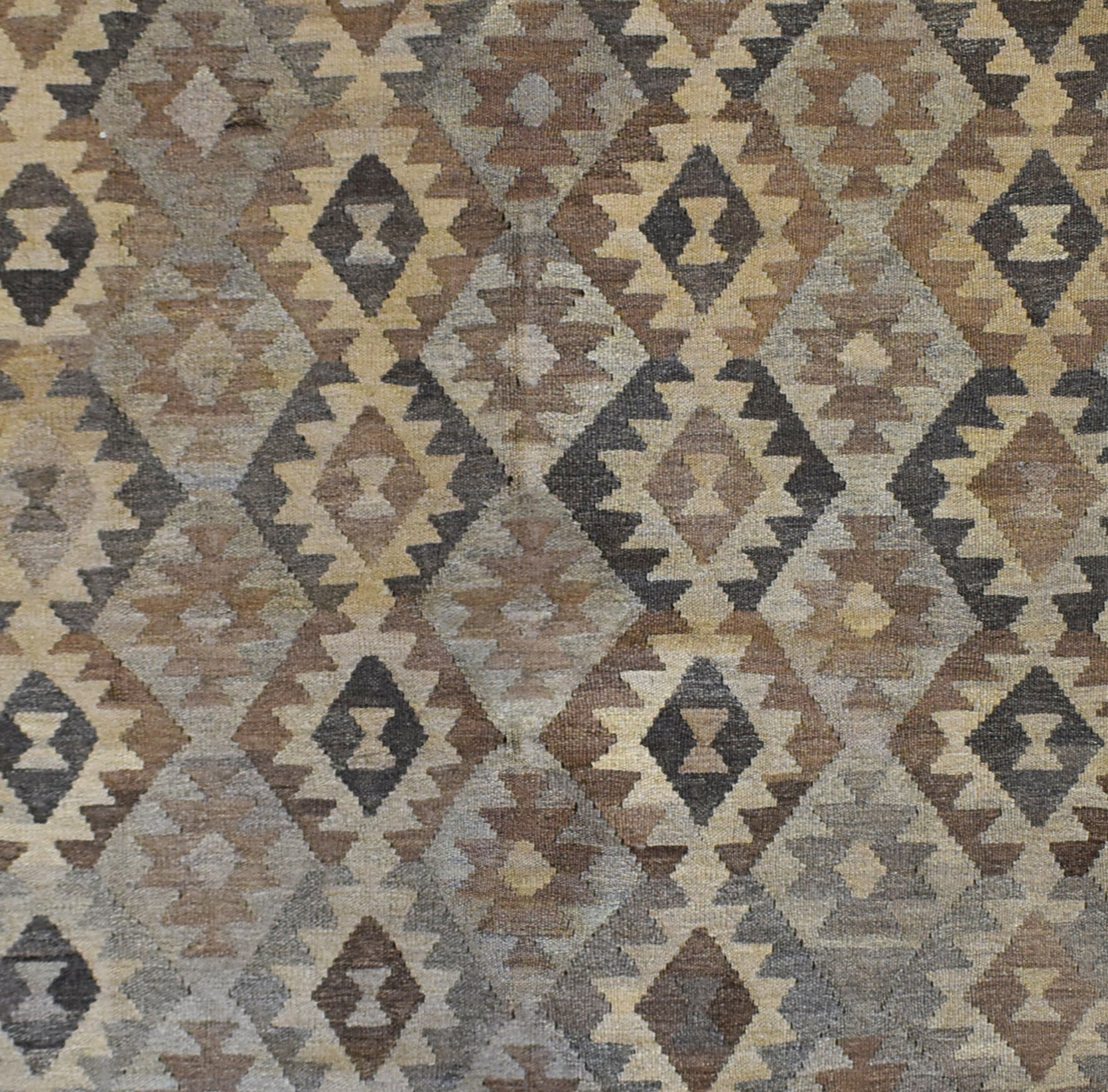 Handmade Afghan Maimana kilim rug featuring a repeating geometric diamond pattern in earthy tones.