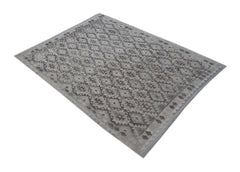A rectangular Afghan Maimana kilim rug featuring a grey geometric pattern on a flat-woven surface.