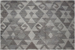 Handwoven Afghan Maimana kilim rug featuring a geometric diamond pattern in natural wool tones.