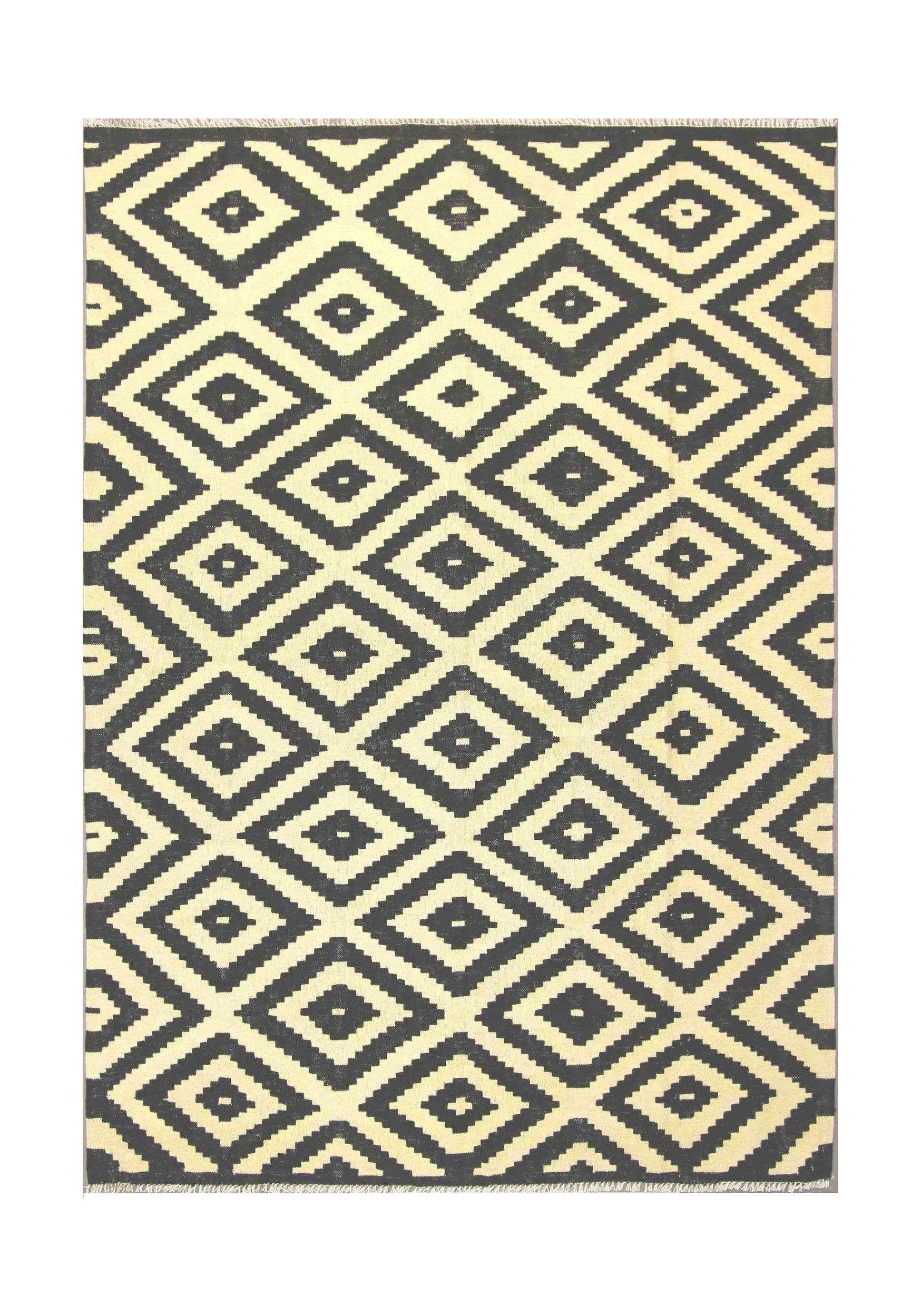 Handmade Afghan Maimana kilim rug featuring a repeating black and cream geometric diamond pattern.