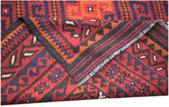 A handwoven Afghan Maimana kilim featuring geometric patterns in red, blue, and black wool.
