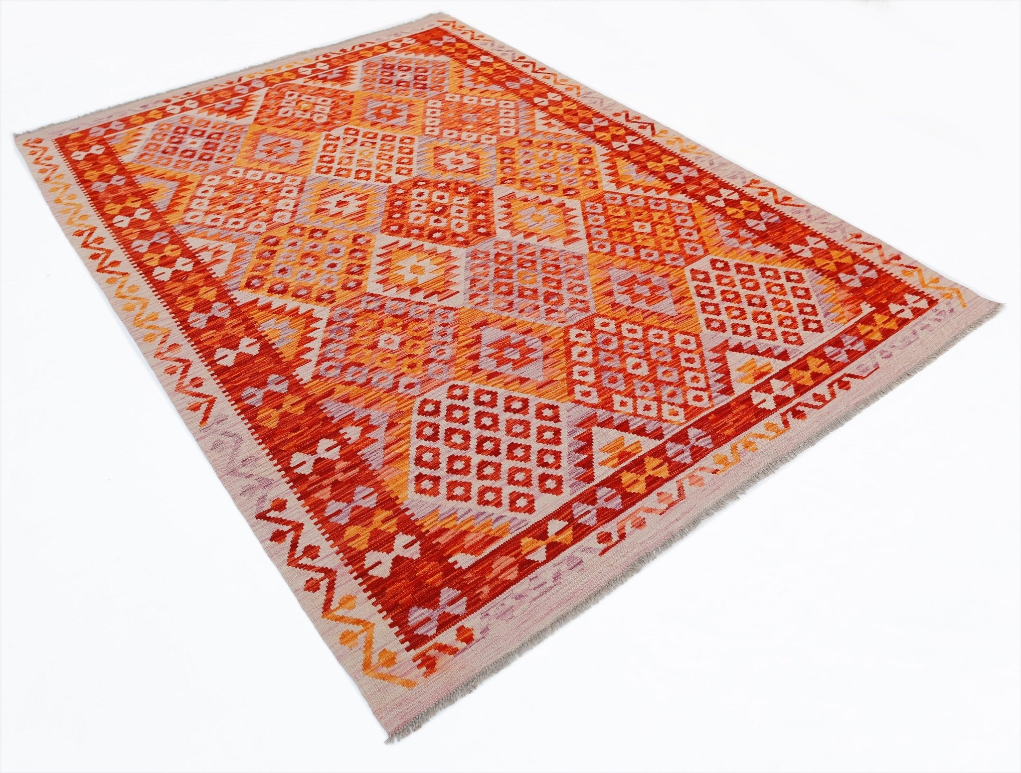 A rectangular Afghan Maimana kilim rug featuring a vibrant geometric pattern in orange and red.