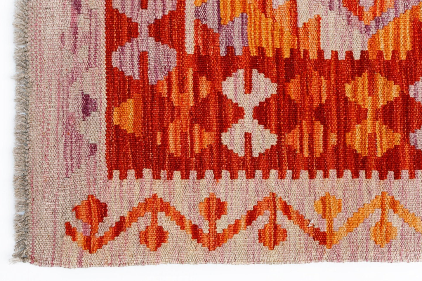 Handwoven Afghan Maimana kilim featuring geometric patterns in shades of red, orange, and cream.