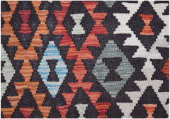 Handwoven Afghan Maimana kilim featuring a geometric diamond pattern in vibrant wool colors.