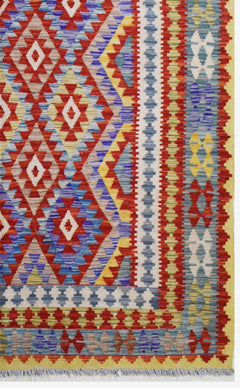 Handmade Afghan Maimana kilim rug featuring a vibrant geometric diamond pattern in wool.