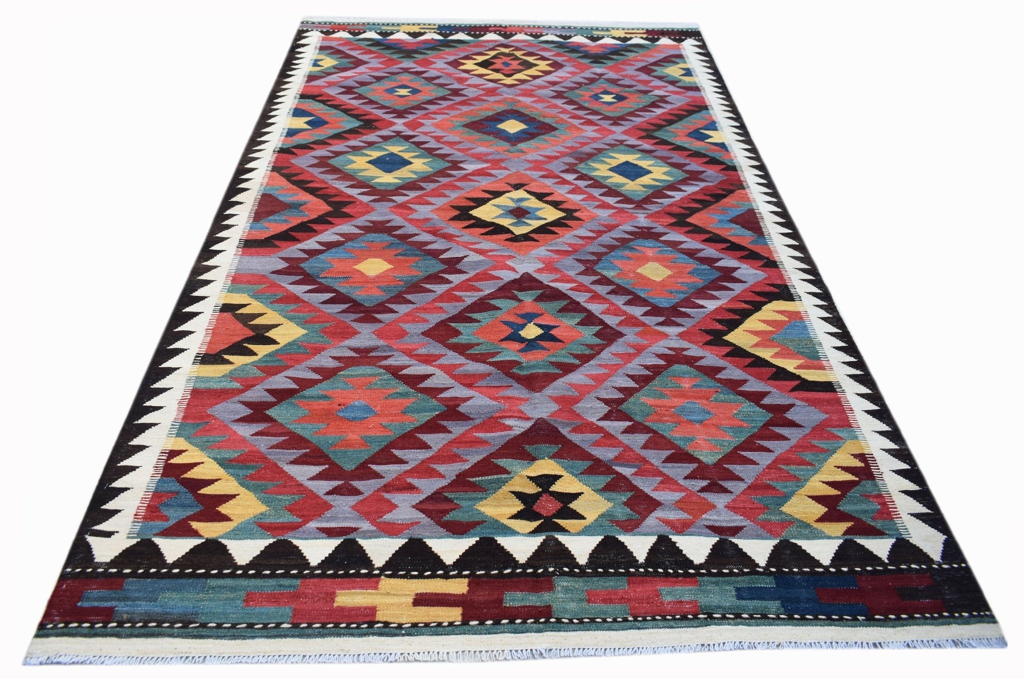 Handwoven Afghan Maimana kilim rug featuring a colorful geometric diamond pattern in wool.