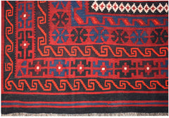 Handwoven Afghan Maimana kilim featuring geometric patterns in red, blue, and black wool.